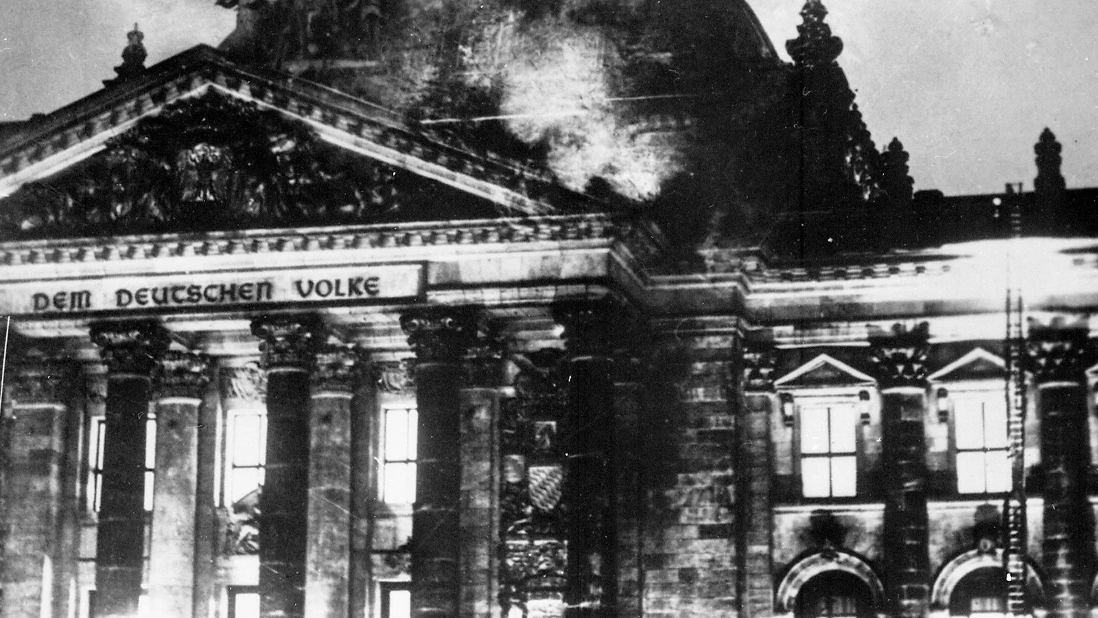 Firefighters work on the burning Reichstag building, Berlin, 27 February 1933.