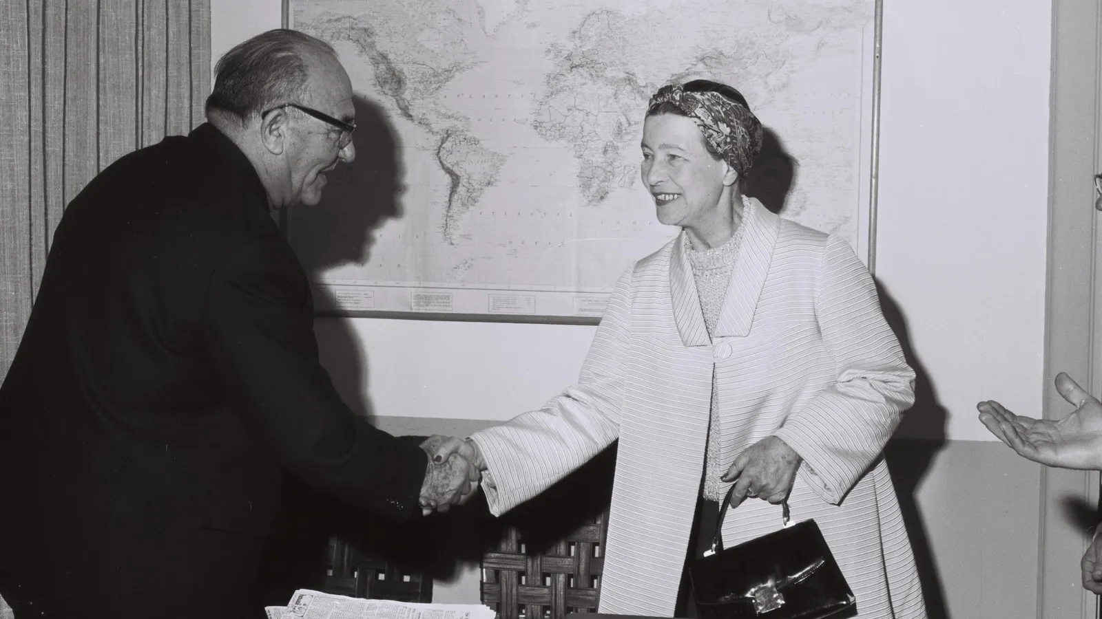 Israeli Prime Minister Levi Eshkol shaking hands with Simone de Beauvoir in his Tel Aviv office, 1967.