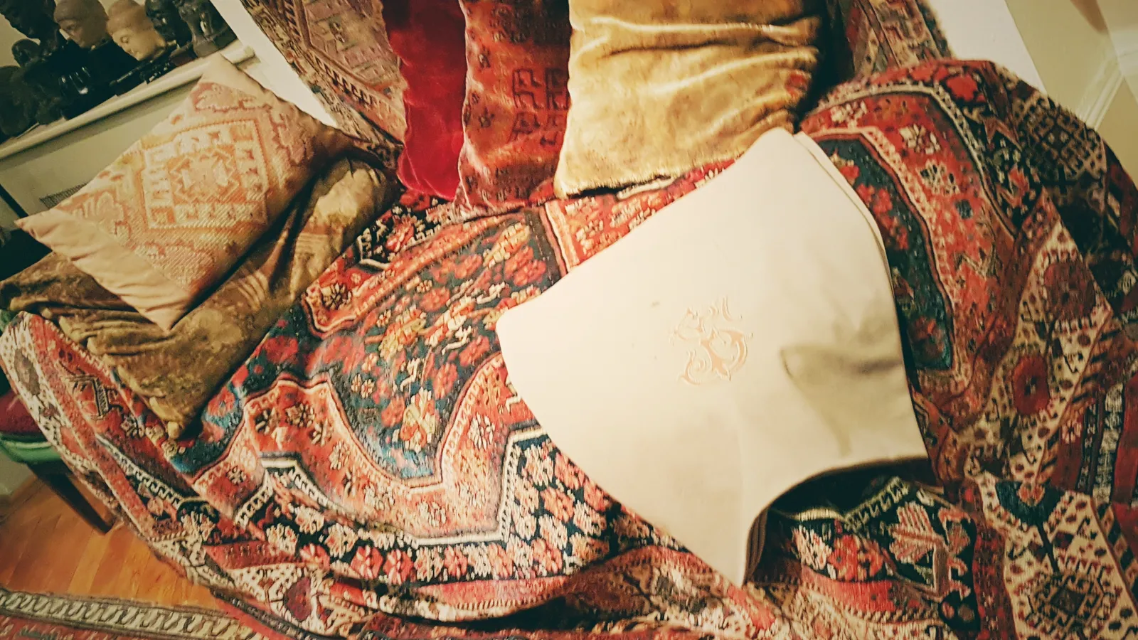 Freud's consulting room couch at Berggasse 19, draped in oriental rugs.