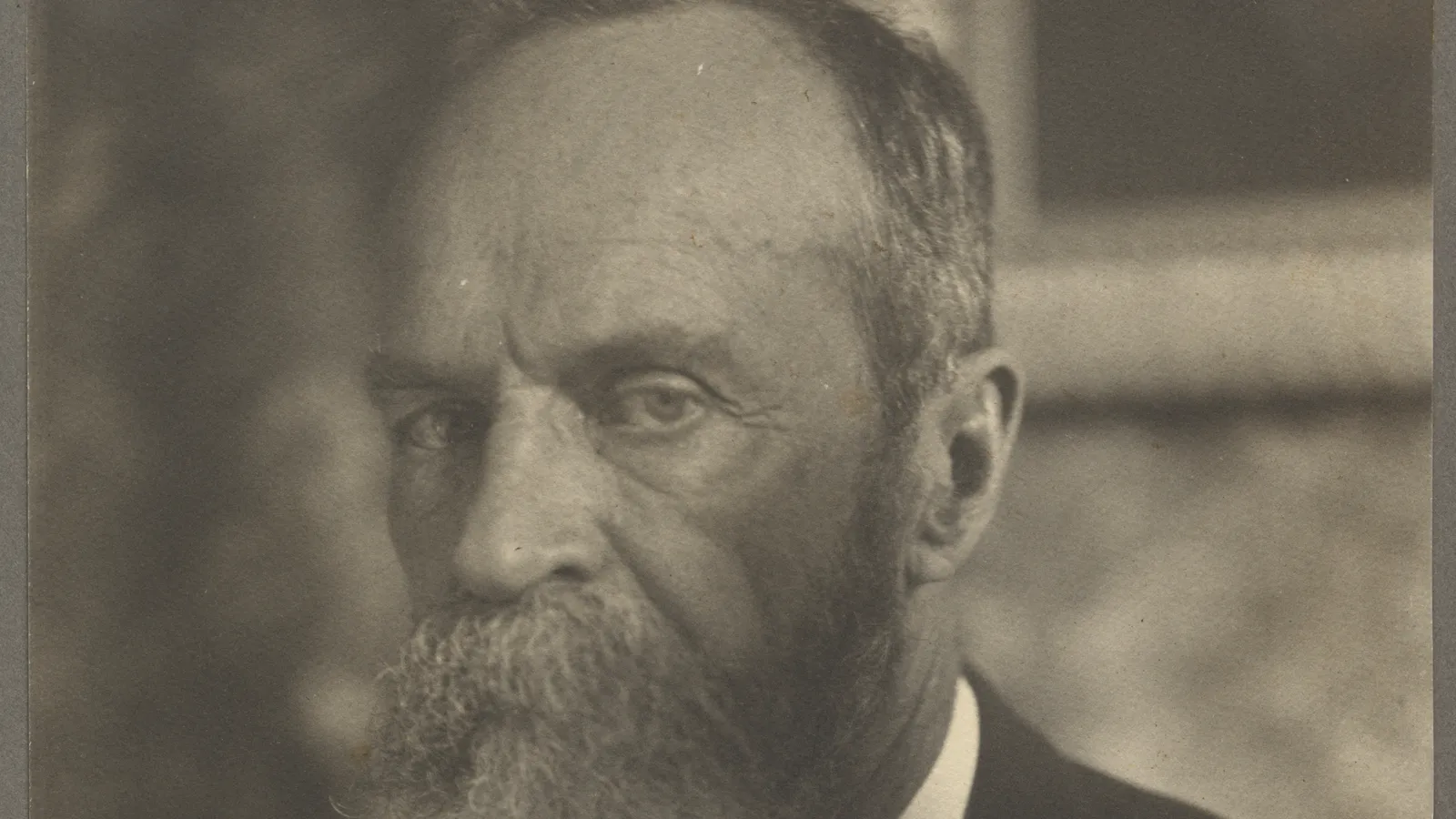 Photograph of William James in three-quarter view, c. 1907.