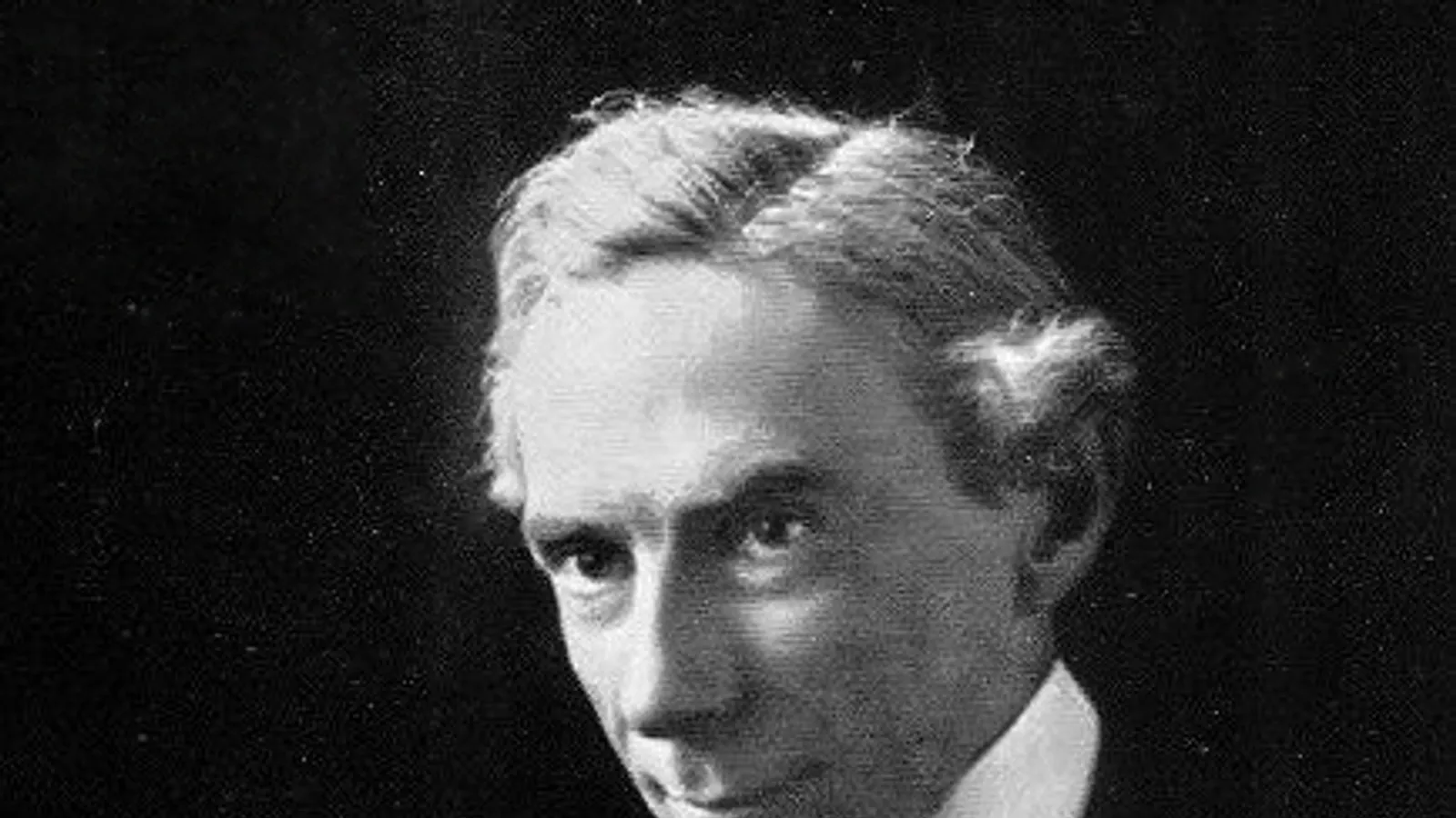 Photographic portrait of Bertrand Russell at his writing desk in 1916.