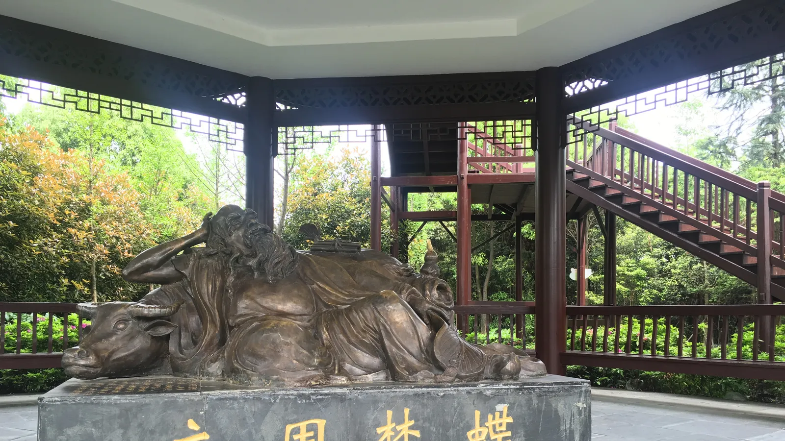 Bronze statue of Zhuangzi reclined at the Guangming Butterfly Valley monument in Hunan.
